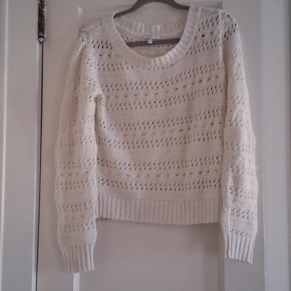 Delia's white sweater